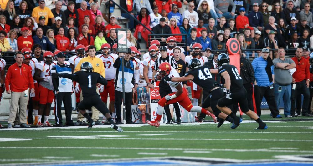 GVL / Kevin Sielaff     Ferris running back Jahaan Brown (24) is taken down by Collin Schlosser (49) of Grand Valley.  Grand Valley State University squares off against Ferris State University Sept. 19 at Lubbers Stadium in Allendale. The Lakers were defeated, with a final score of 61-24.