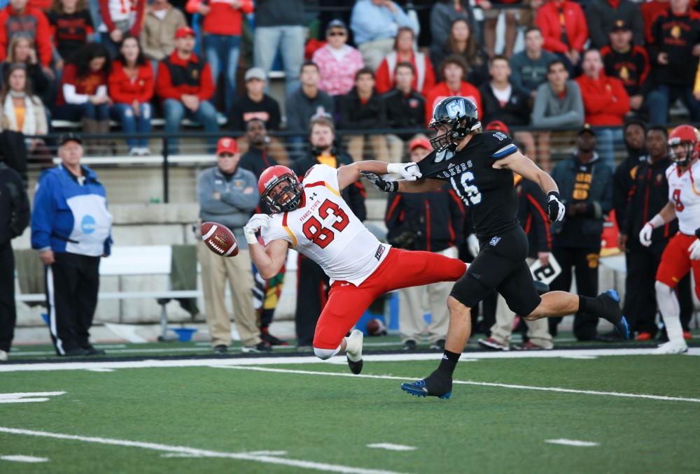 GVL / Kevin Sielaff     Brad Horling (16) contests a pass to Ferris' Kyle Thompson (83).  Grand Valley State University squares off against Ferris State University Sept. 19 at Lubbers Stadium in Allendale. The Lakers were defeated, with a final score of 61-24.