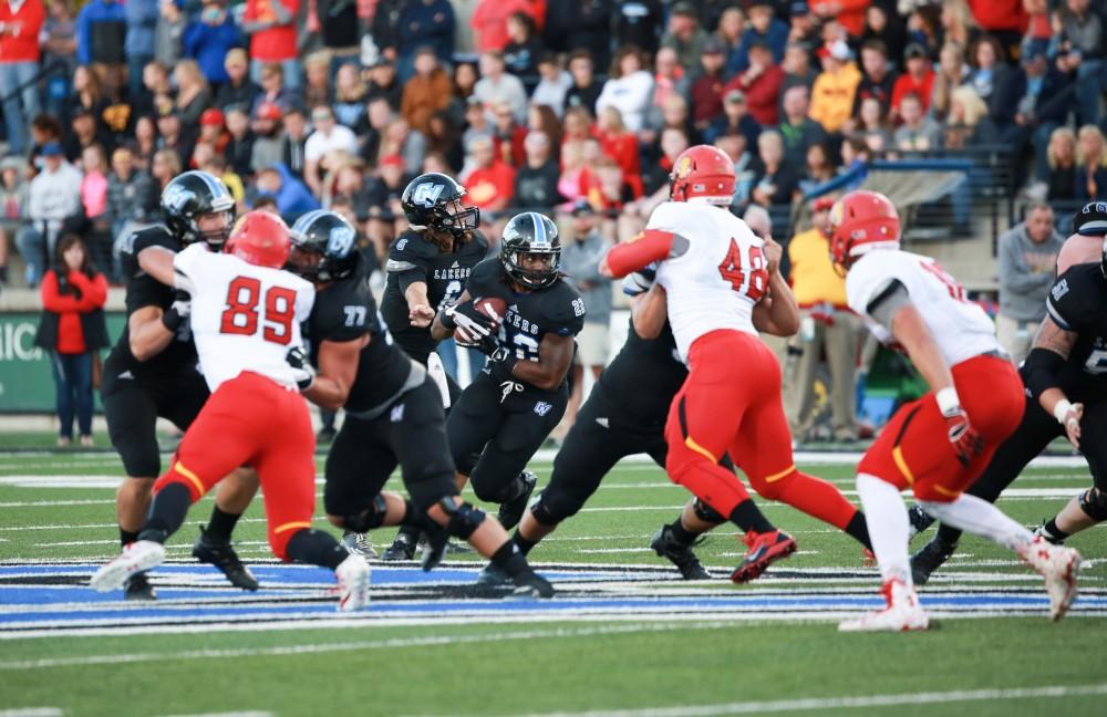 GVL / Kevin Sielaff     Terrell Dorsey (22) attempts to slip through Ferris' defense. Grand Valley State University squares off against Ferris State University Sept. 19 at Lubbers Stadium in Allendale. The Lakers were defeated, with a final score of 61-24.