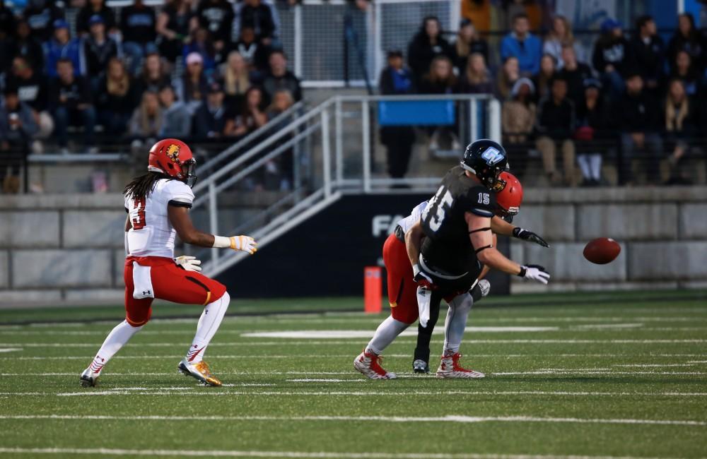 GVL / Kevin Sielaff     Jamie Potts (15) is hit, and loses the ball. Grand Valley State University squares off against Ferris State University Sept. 19 at Lubbers Stadium in Allendale. The Lakers were defeated, with a final score of 61-24.