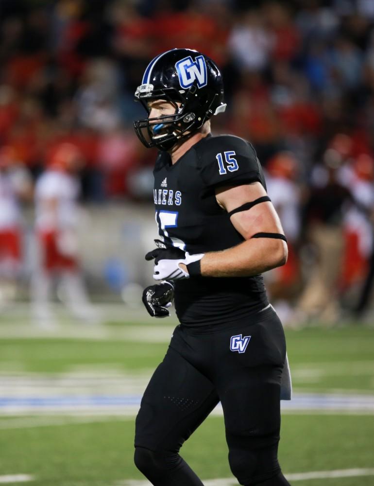 GVL / Kevin Sielaff     Jamie Potts (15) head back toward the Grand Valley bench. Grand Valley State University squares off against Ferris State University Sept. 19 at Lubbers Stadium in Allendale. The Lakers were defeated, with a final score of 61-24.