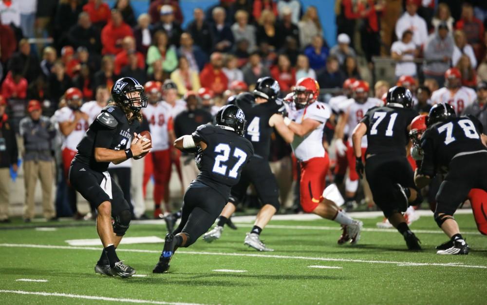 GVL / Kevin Sielaff     Bart Williams (6) steps back in the pocket and looks for a receiver. Grand Valley State University squares off against Ferris State University Sept. 19 at Lubbers Stadium in Allendale. The Lakers were defeated, with a final score of 61-24.