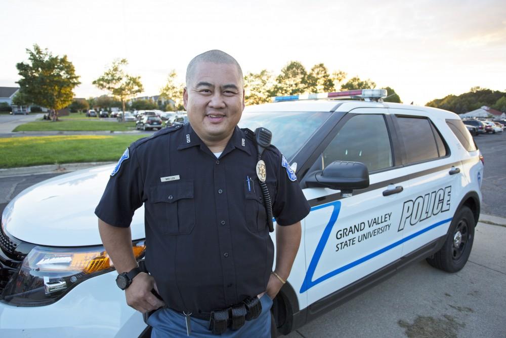 GVL/Kevin Sielaff
GVPD officer Minh Lien poses outside his patrol car Sept. 13.