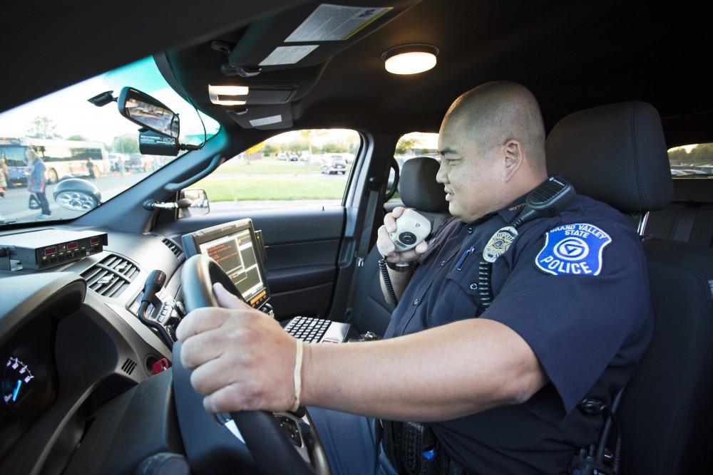 GVL/Kevin Sielaff
GVPD officer Minh Lien works within his patrol car Sept. 13 outside of Campus Life Night. 