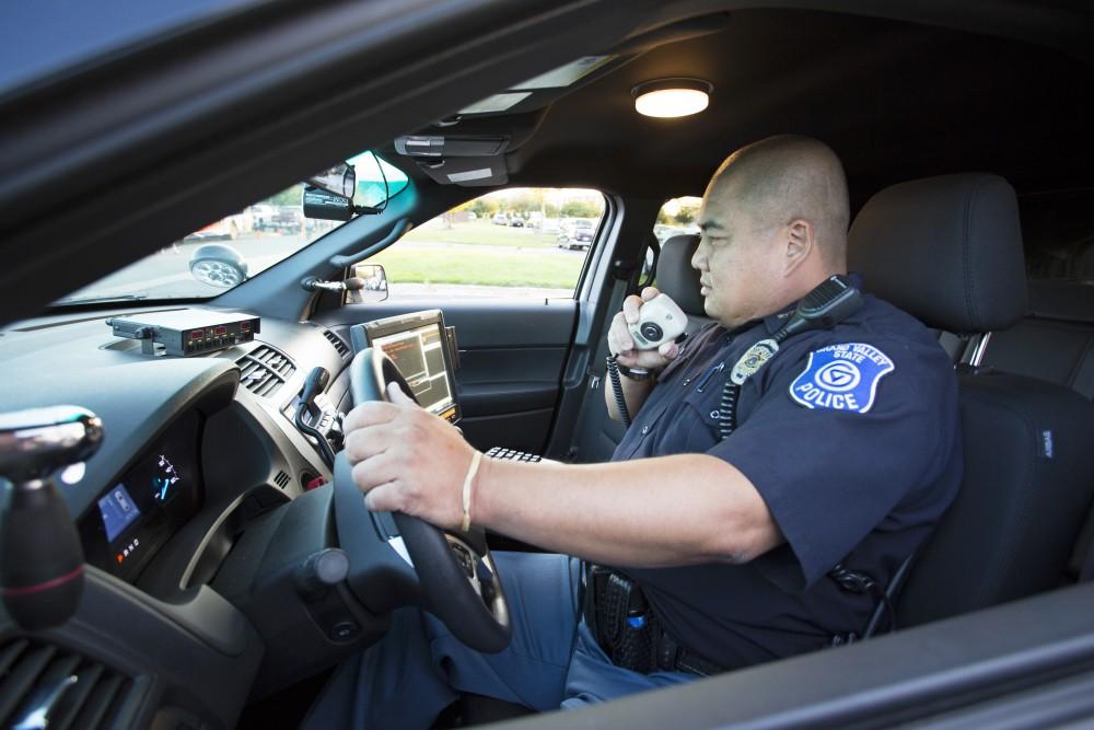 GVL/Kevin Sielaff
GVPD officer Minh Lien works within his patrol car Sept. 13 outside of Campus Life Night. 