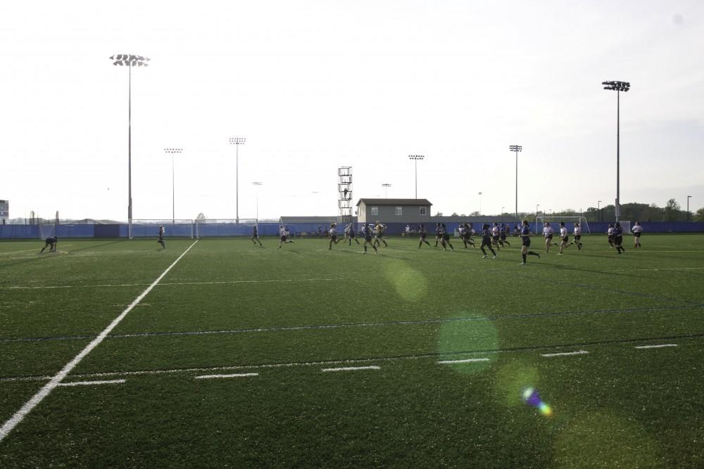 GVL / Sara Carte
Grand Valley’s Women’s Club Rugby team goes against Indiana University on Friday night, September 4, 2015.