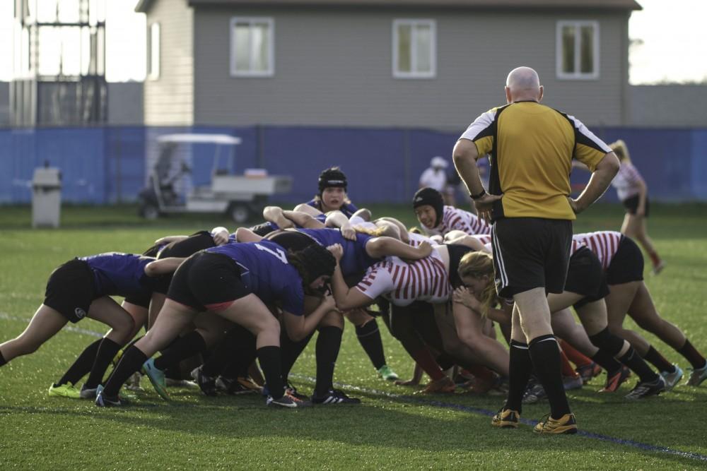 GVL / Sara Carte
Grand Valley’s Women’s Club Rugby team fights for the ball against Indiana University on Friday night, September 4, 2015.