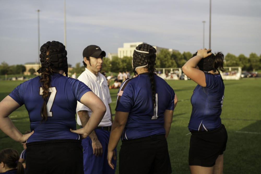 GVL / Sara Carte
Grand Valley’s Women’s Club Rugby coach, Abe Cohen, talks with his players during half time against Indiana University on Friday night, September 4, 2015. 