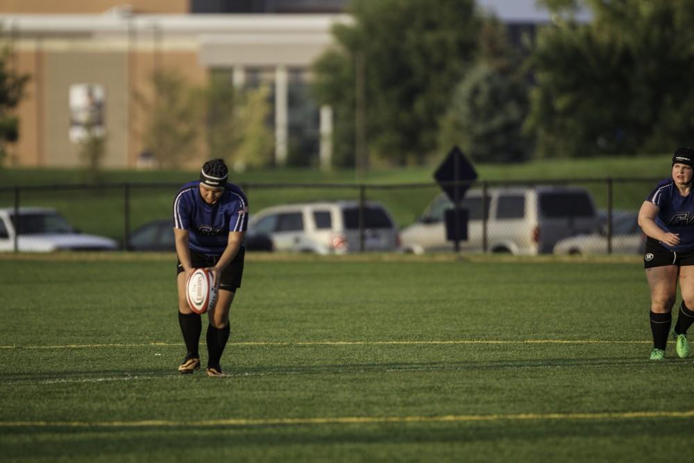 GVL / Sara Carte
Grand Valley’s Women’s Club Rugby player, Leah Fast, gets ready to kick the ball to her teammates on Friday night, September 4, 2014.