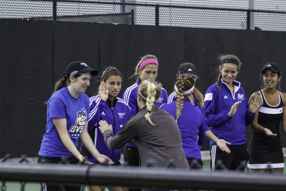 GVL / Sara Carte
Grand Valley’s Women’s Tennis team gets ready to go against Northwood University on Sunday, September 13, 2015.