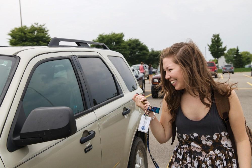 GVL / Sara Carte
Grand Valley student, Bethany Garcia, locks her car on her way to class on Tuesday, September 8, 2015.