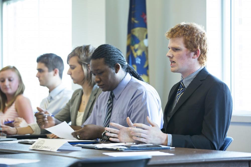 GVL / Kevin Sielaff    
Jeremy Turnbull speaks to the senators. The Student Senate convenes Sept. 3 inside the Kirkhoff Center at Grand Valley's Allendale campus. 