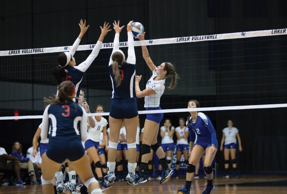 GVL / Kevin Sielaff     Betsy Rhonda (6) is blocked by SVSU. The Laker Vollyeball team squares off against SVSU Sept. 19 inside the Fieldhouse Arena in Allendale. The Lakers defeated SVSU by a margin of 3-1.