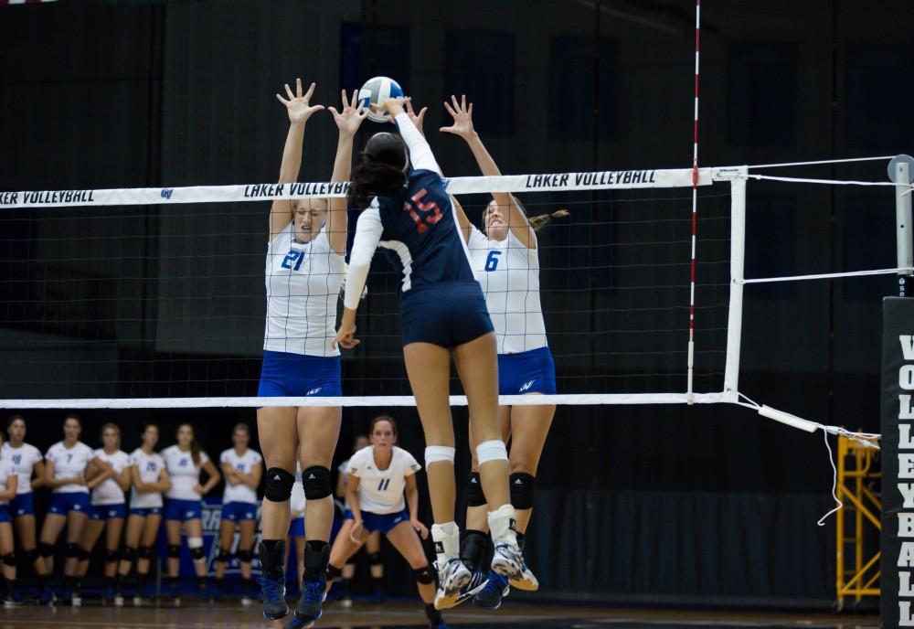 GVL / Kevin Sielaff     Staci Brower (21) and Betsy Rhonda (6) attempt a block. The Laker Vollyeball team squares off against SVSU Sept. 19 inside the Fieldhouse Arena in Allendale. The Lakers defeated SVSU by a margin of 3-1.