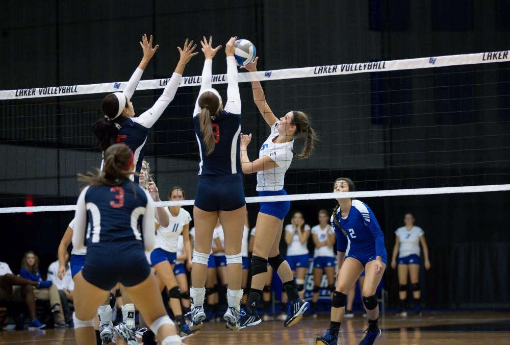 GVL / Kevin Sielaff     Betsy Rhonda (6) is blocked by SVSU. The Laker Vollyeball team squares off against SVSU Sept. 19 inside the Fieldhouse Arena in Allendale. The Lakers defeated SVSU by a margin of 3-1.