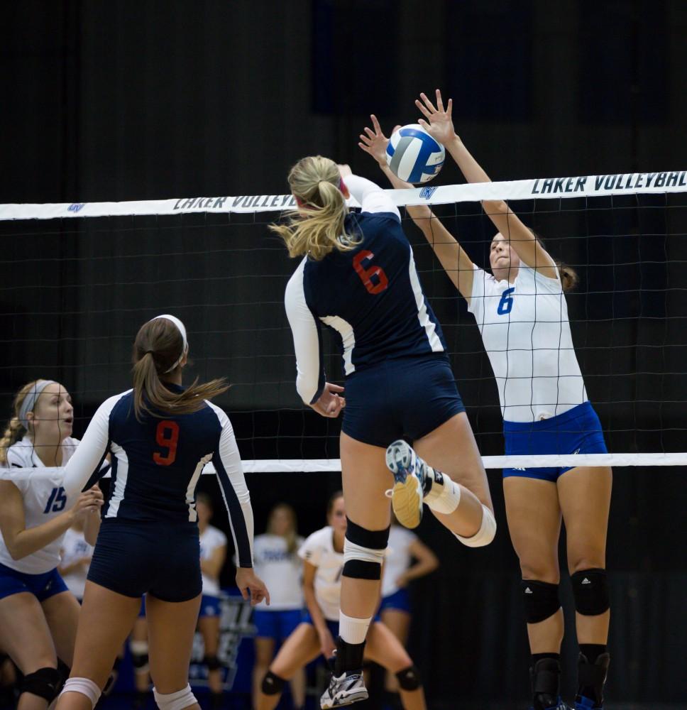 GVL / Kevin Sielaff    Betsy Rhonda (6) blocks an incoming spike.  The Laker Vollyeball team squares off against SVSU Sept. 19 inside the Fieldhouse Arena in Allendale. The Lakers defeated SVSU by a margin of 3-1.