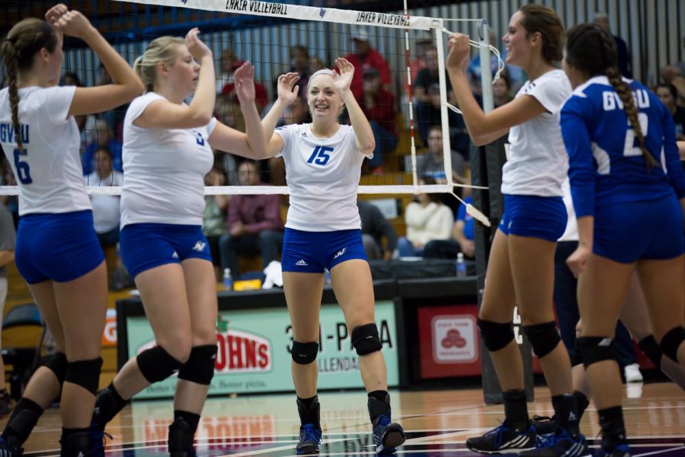 GVL / Kevin Sielaff     Kaleigh Lound (15) celebrates with her team. The Laker Vollyeball team squares off against SVSU Sept. 19 inside the Fieldhouse Arena in Allendale. The Lakers defeated SVSU by a margin of 3-1.