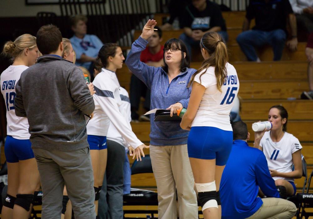 GVL / Kevin Sielaff    Head coach Deanne Scanlon speaks to her team during a time-out. The Laker Vollyeball team squares off against SVSU Sept. 19 inside the Fieldhouse Arena in Allendale. The Lakers defeated SVSU by a margin of 3-1.