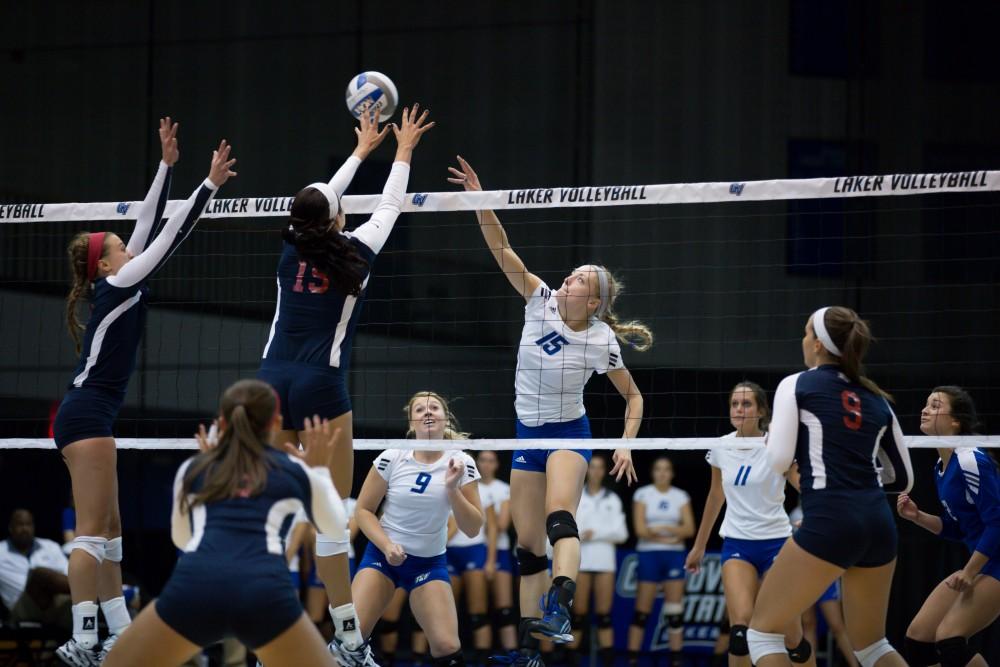 GVL / Kevin Sielaff     Kaleigh Lound (15) is blocked by SVSU.  The Laker Vollyeball team squares off against SVSU Sept. 19 inside the Fieldhouse Arena in Allendale. The Lakers defeated SVSU by a margin of 3-1.