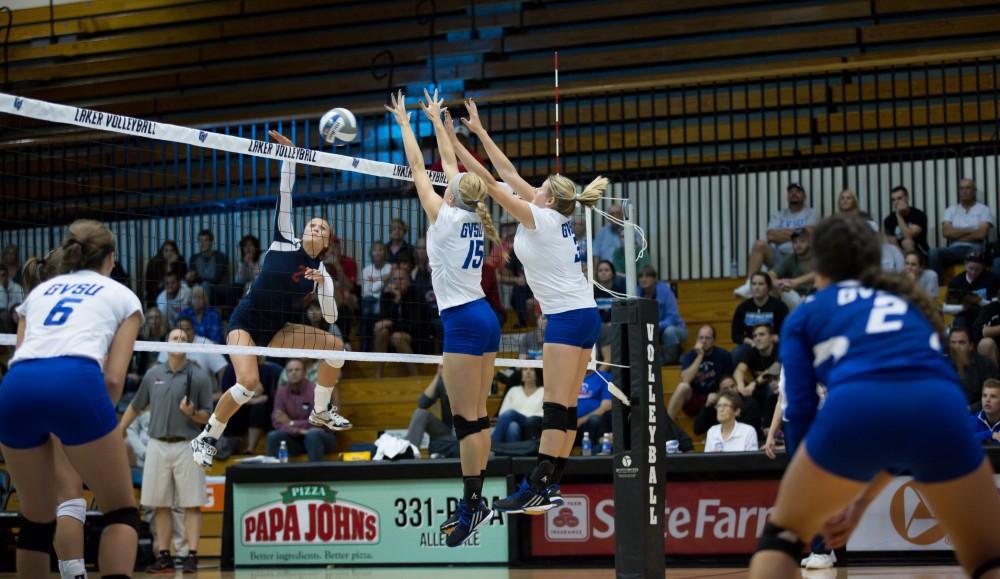 GVL / Kevin Sielaff     Kaleigh Lound (15) and Jessica Majerle (3) fight off an incoming spike.  The Laker Vollyeball team squares off against SVSU Sept. 19 inside the Fieldhouse Arena in Allendale. The Lakers defeated SVSU by a margin of 3-1.