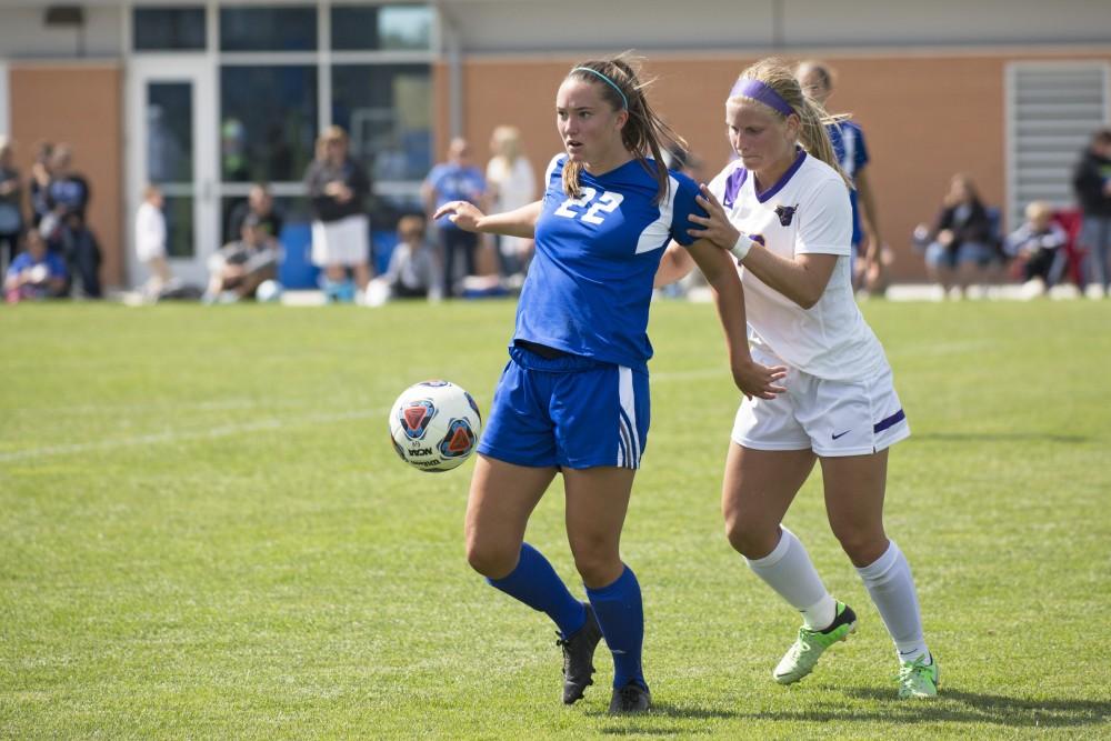 GVL/Kevin Sielaff
Samantha Riga backs into a Minnesota defender. Grand Valley's women's soccer team defeats #4 ranked Minnesota State by a score of 2-1 Sept. 13. 