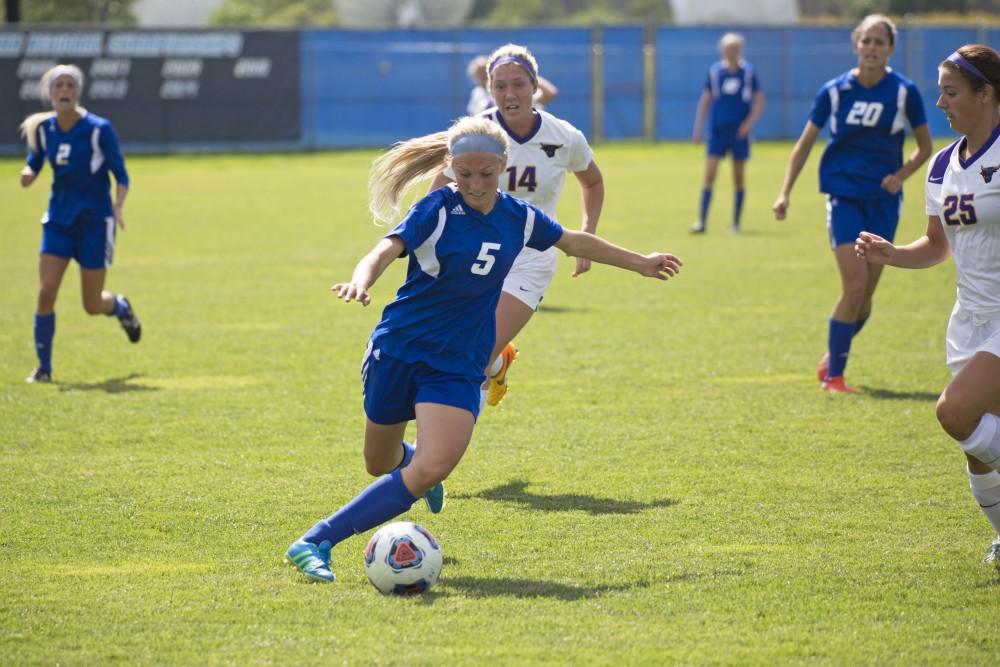 GVL/Kevin Sielaff
Kendra Stauffer crosses the ball. Grand Valley's women's soccer team defeats #4 ranked Minnesota State by a score of 2-1 Sept. 13. 