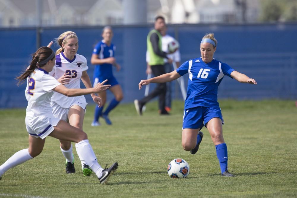 GVL/Kevin Sielaff
Dani Johnson swivels around two Minnesota defenders. Grand Valley's women's soccer team defeats #4 ranked Minnesota State by a score of 2-1 Sept. 13. 