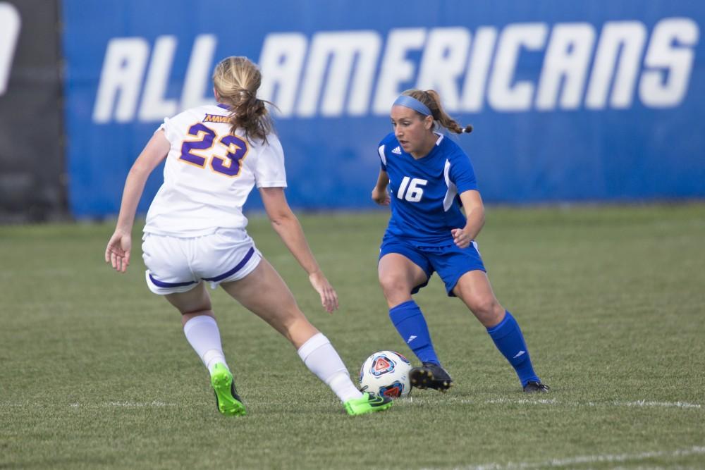 GVL/Kevin Sielaff
Dani Johnson moves around Jenny Hoerter of Minnesota State. Grand Valley's women's soccer team defeats #4 ranked Minnesota State by a score of 2-1 Sept. 13. 