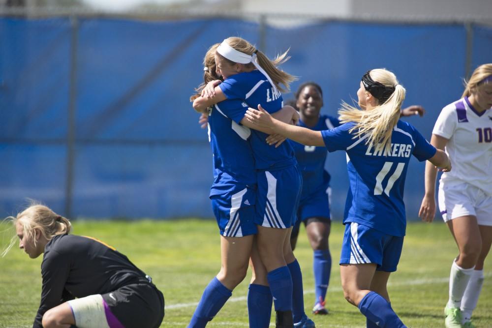 GVL/Kevin Sielaff
The team celebrates a goal by Marti Corby. Grand Valley's women's soccer team defeats #4 ranked Minnesota State by a score of 2-1 Sept. 13. 