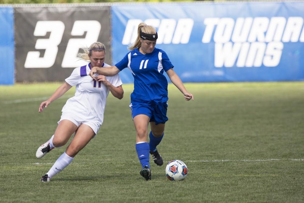 GVL/Kevin Sielaff
Sara Stevens holds off a Minnesota defender. Grand Valley's women's soccer team defeats #4 ranked Minnesota State by a score of 2-1 Sept. 13. 