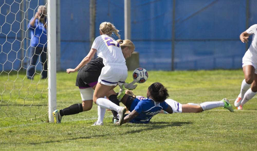 GVL/Kevin Sielaff
Goalkeeper Lauren Hoeppner saves a shot from Katie Bounds. Grand Valley's women's soccer team defeats #4 ranked Minnesota State by a score of 2-1 Sept. 13.