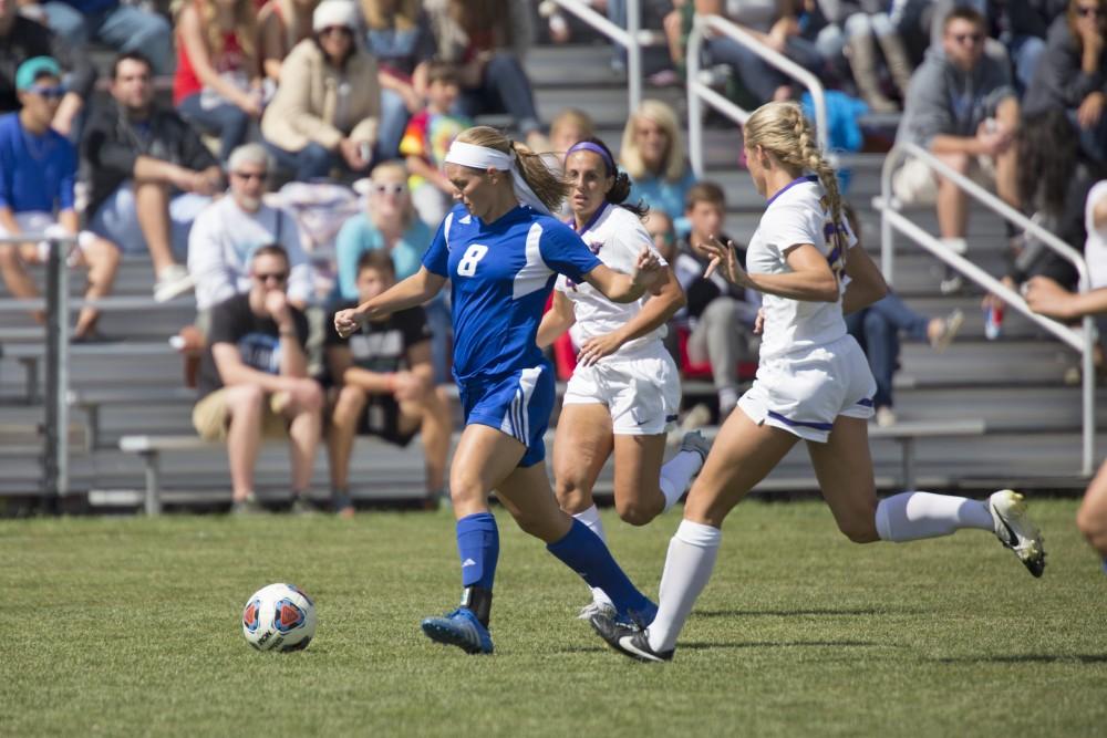 GVL/Kevin Sielaff
Tara Lierman dribbles the ball through two Minnesota State players. Grand Valley's women's soccer team defeats #4 ranked Minnesota State by a score of 2-1 Sept. 13. 