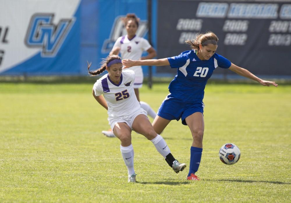 GVL/Kevin Sielaff
Gabriella Mencotti fights off Lexi Pszanka of Minnesota State. Grand Valley's women's soccer team defeats #4 ranked Minnesota State by a score of 2-1 Sept. 13. 