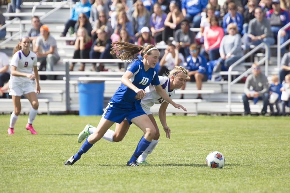 GVL/Kevin Sielaff
Shannon Quinn fights off the Minnesota State attack. Grand Valley's women's soccer team defeats #4 ranked Minnesota State by a score of 2-1 Sept. 13. 