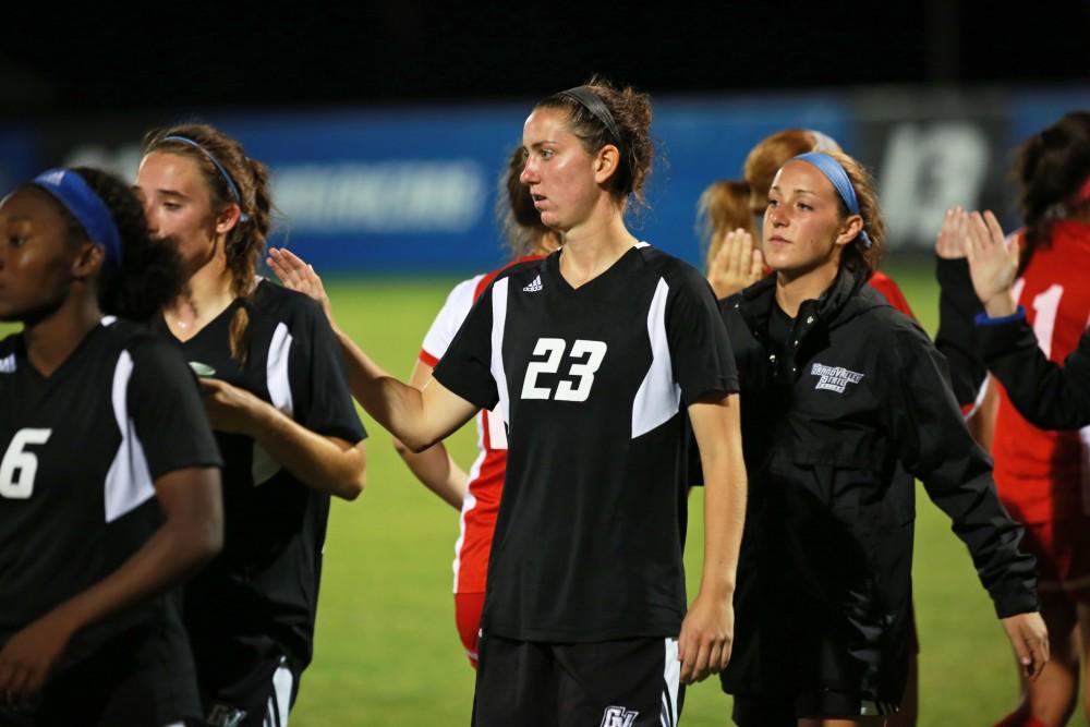 GVL/Kevin Sielaff  
Katey Woolley (23) shakes hands with SVSU players after the game. The Laker soccer team defeats SVSU Sept. 22 by a margin of 6-1 in Allendale.  