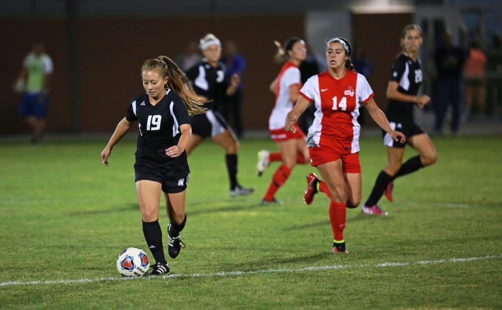 GVL/Kevin Sielaff  
Hannah Phommavongsa (19) dribbles the ball around midfield. The Laker soccer team defeats SVSU Sept. 22 by a margin of 6-1 in Allendale.  