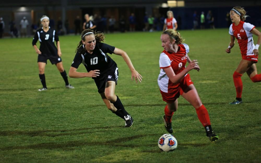 GVL/Kevin Sielaff  
Shannon Quinn (10) chases after an SVSU attacker. The Laker soccer team defeats SVSU Sept. 22 by a margin of 6-1 in Allendale.  