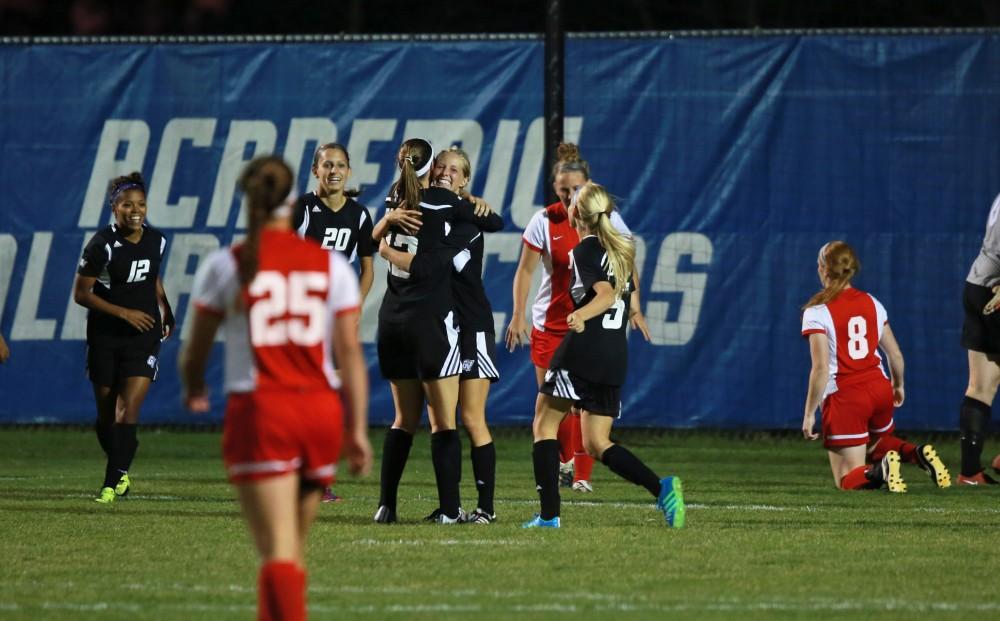 GVL/Kevin Sielaff  
Katie Klunder (2) celebrates a goal with her teammates. The Laker soccer team defeats SVSU Sept. 22 by a margin of 6-1 in Allendale.  