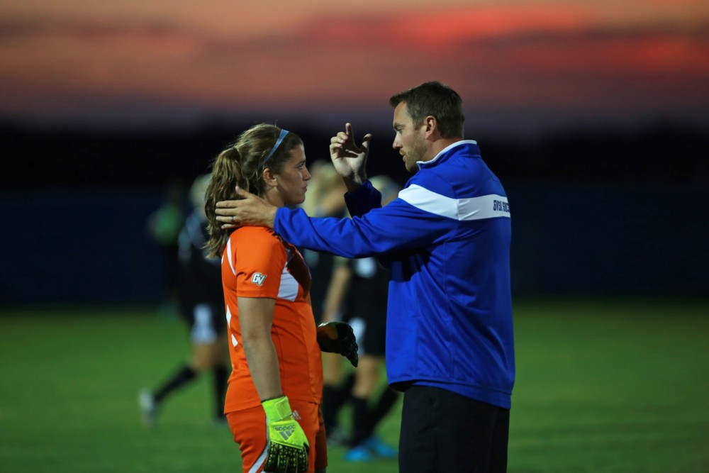 GVL/Kevin Sielaff  
Emily Maresh (0) and head coach Jeff Hosler speak before the start of the second half. The Laker soccer team defeats SVSU Sept. 22 by a margin of 6-1 in Allendale.  