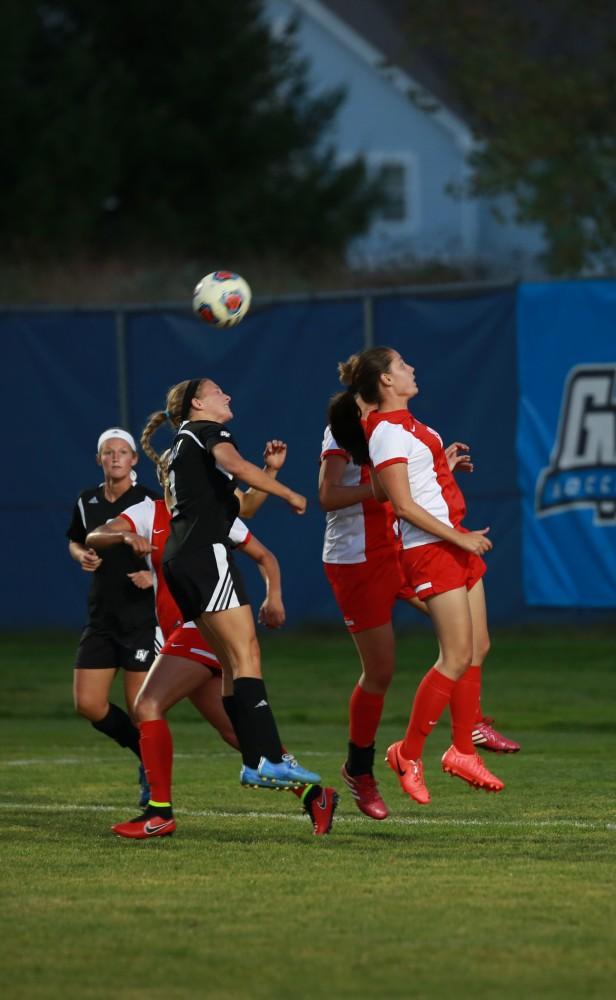 GVL/Kevin Sielaff  
Madz Ham (9) heads the ball. The Laker soccer team defeats SVSU Sept. 22 by a margin of 6-1 in Allendale.  