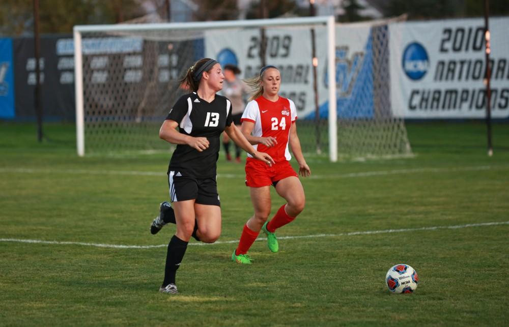 GVL/Kevin Sielaff  
Marti Corby (13) moves the ball against Maddison Smith (24). The Laker soccer team defeats SVSU Sept. 22 by a margin of 6-1 in Allendale.  