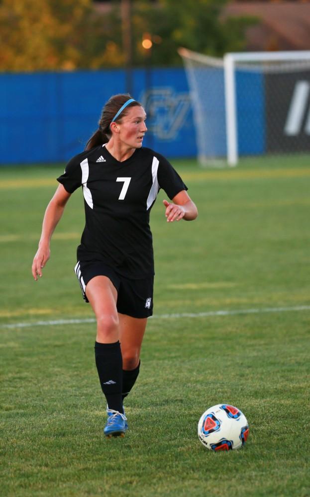 GVL/Kevin Sielaff  
Clare Carlson (7) dribbles the ball up field. The Laker soccer team defeats SVSU Sept. 22 by a margin of 6-1 in Allendale.