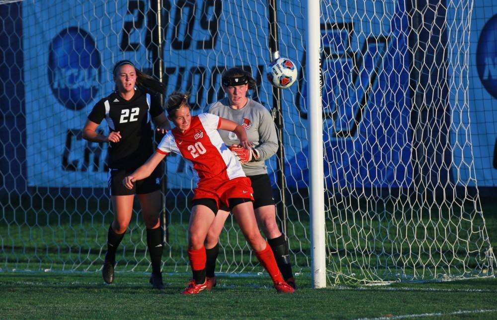 GVL/Kevin Sielaff  
Svenja Luedtke (20) of SVSU heads the ball away from attacking Samantha Riga (22). The Laker soccer team defeats SVSU Sept. 22 by a margin of 6-1 in Allendale.  