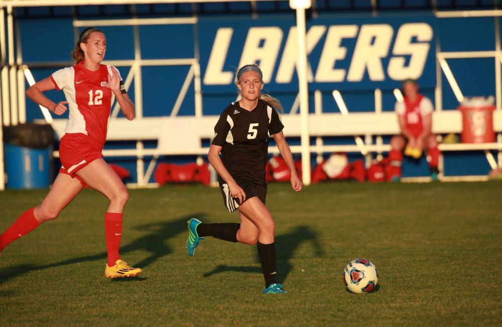 GVL/Kevin Sielaff  
Kendra Stauffer (5) dribbles the ball up field. The Laker soccer team defeats SVSU Sept. 22 by a margin of 6-1 in Allendale.  