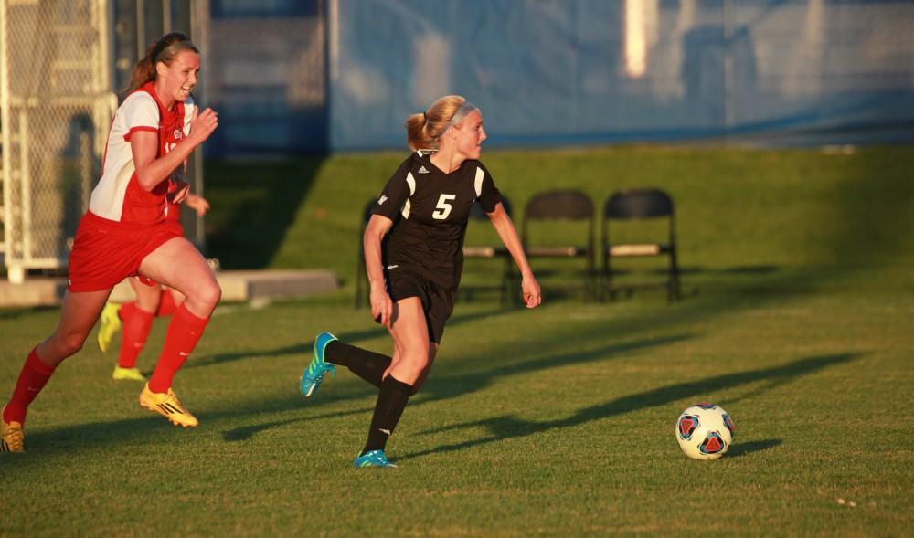 GVL/Kevin Sielaff  
Kendra Stauffer (5) dribbles the ball up field. The Laker soccer team defeats SVSU Sept. 22 by a margin of 6-1 in Allendale.