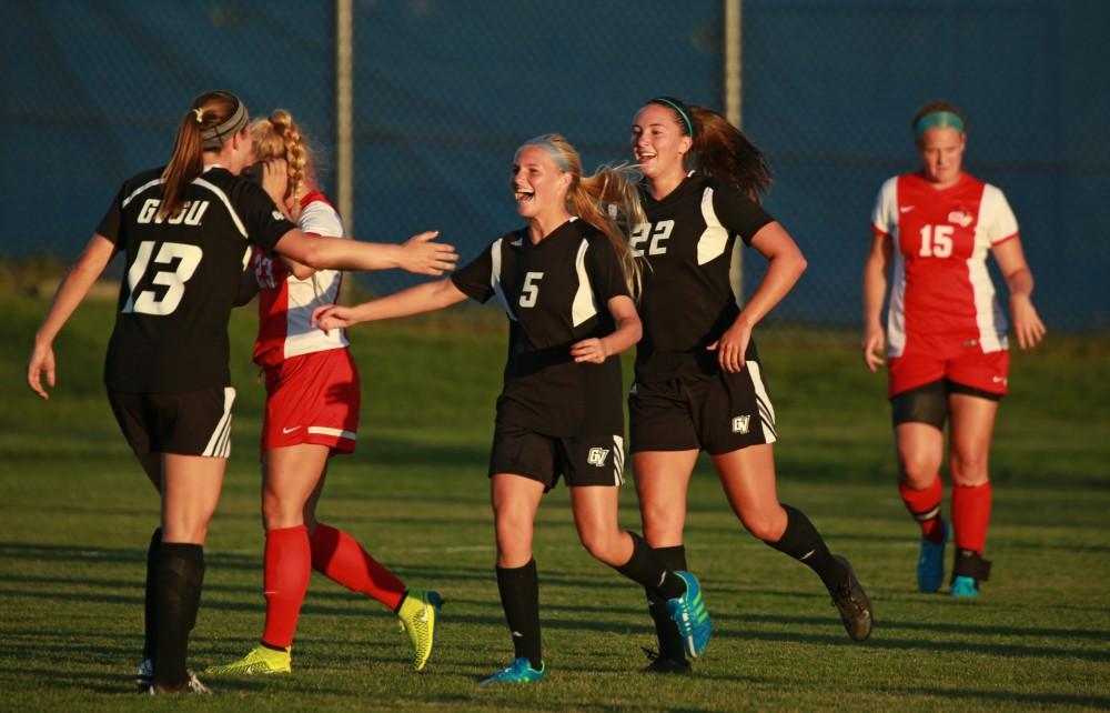 GVL/Kevin Sielaff  
Kendra Stauffer (5) celebrates a goal with Marti Corby (13). The Laker soccer team defeats SVSU Sept. 22 by a margin of 6-1 in Allendale.  