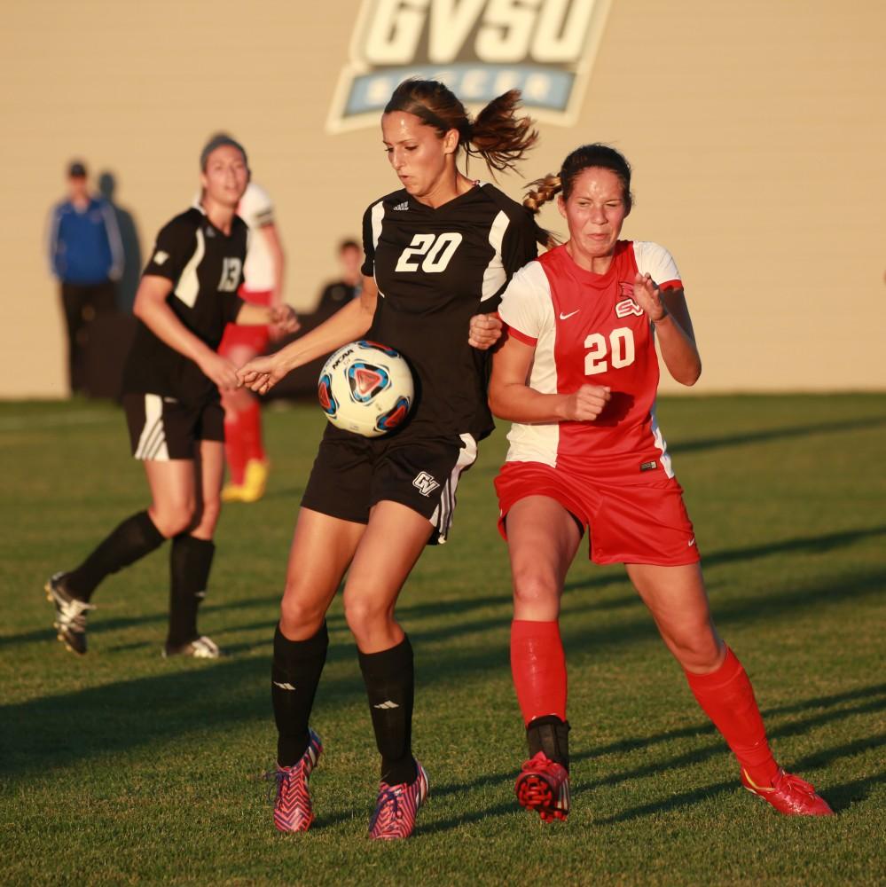 GVL/Kevin Sielaff  
Gabriella Mencotti (20) pushes through Svenja Luedtke (20) of SVSU. The Laker soccer team defeats SVSU Sept. 22 by a margin of 6-1 in Allendale.  