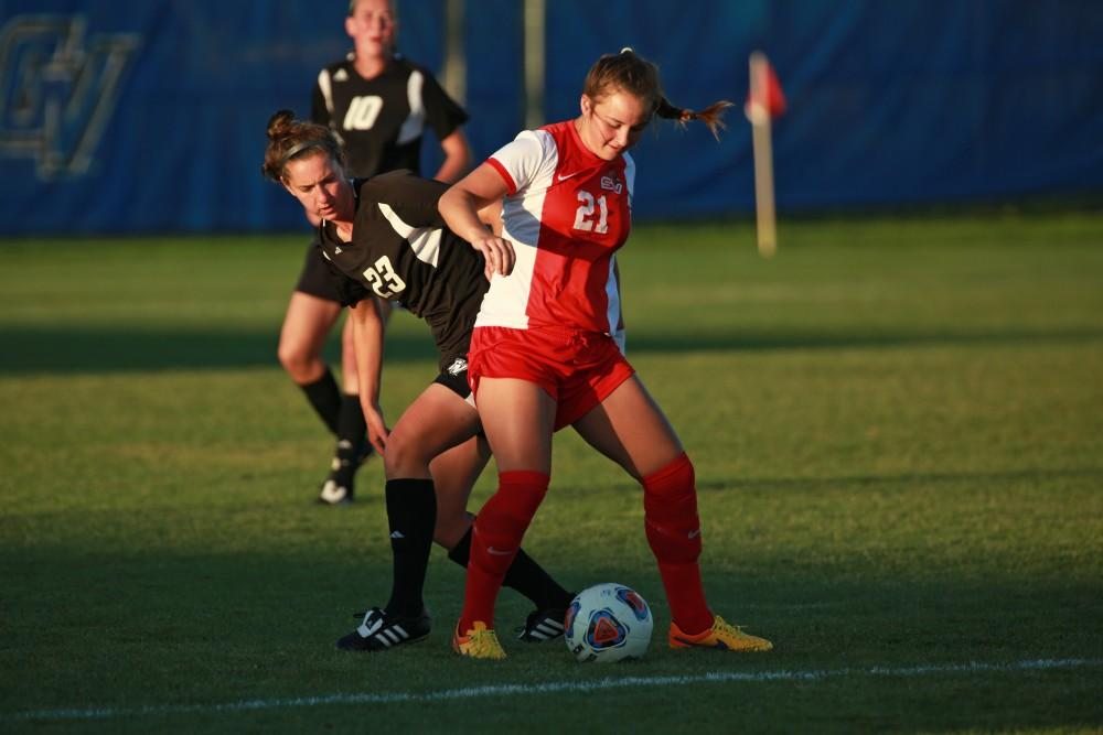 GVL/Kevin Sielaff  
Katey Woolley (23) looks to steal the ball from Whitney Fleming (21) of SVSU. The Laker soccer team defeats SVSU Sept. 22 by a margin of 6-1 in Allendale.  