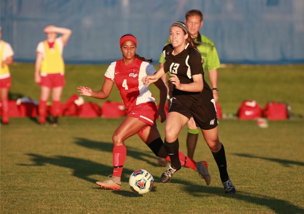 GVL/Kevin Sielaff  
Marti Coby (13) looks for an open Grand Valley player. The Laker soccer team defeats SVSU Sept. 22 by a margin of 6-1 in Allendale.  