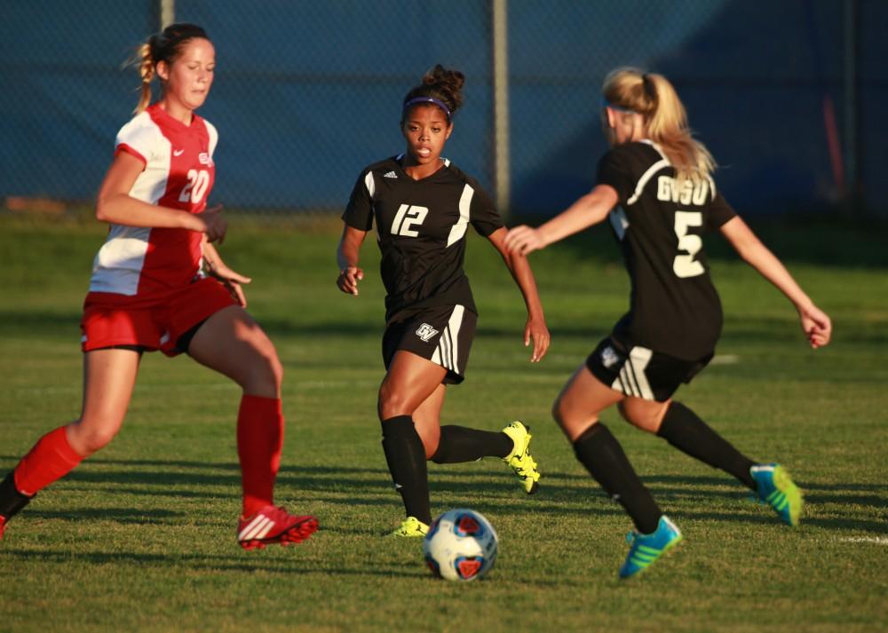 GVL/Kevin Sielaff  
Jayla Martin (12) looks to receive a pass from Kendra Stauffer (12). The Laker soccer team defeats SVSU Sept. 22 by a margin of 6-1 in Allendale.  